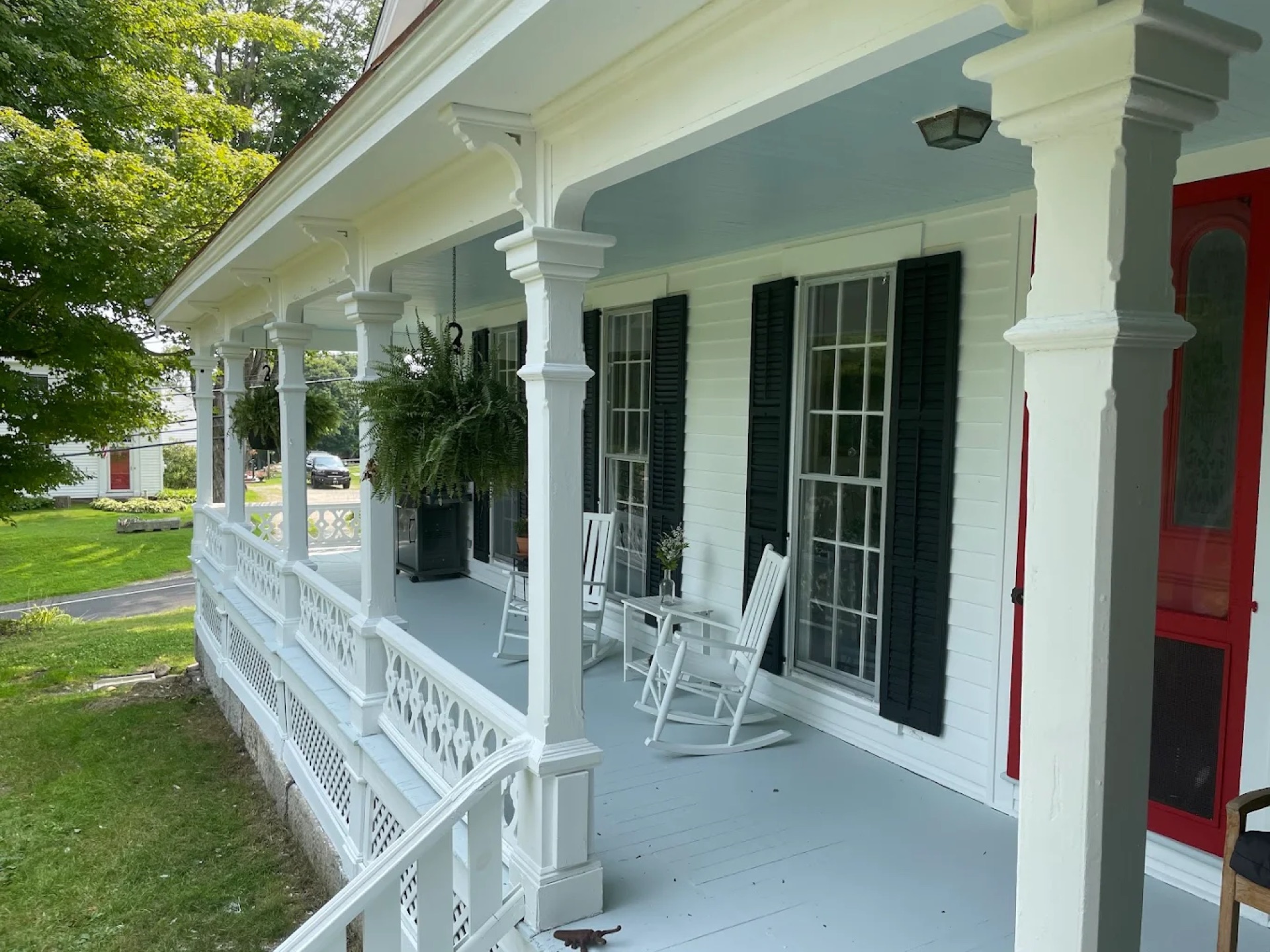 Exterior painting - farmhouse porch with rocking chairs Connecticut