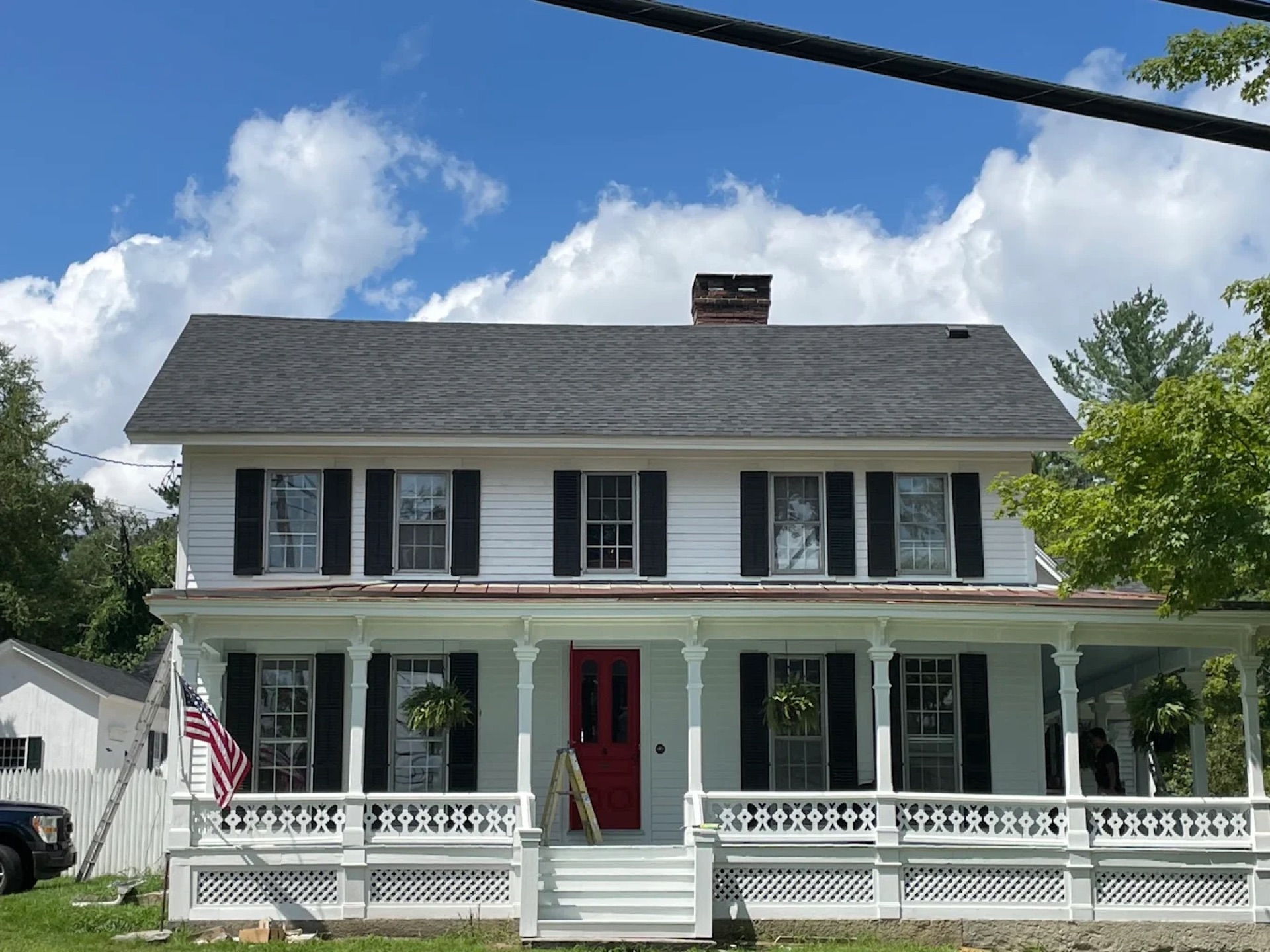 Exterior painting - navy blue colonial home aerial view Connecticut